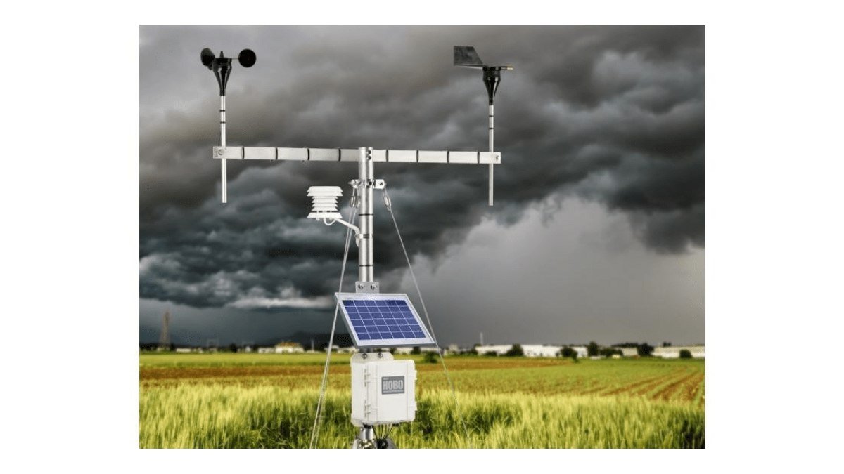 HOBO Advanced Weather Station Kit deployed in a field ahead of a storm